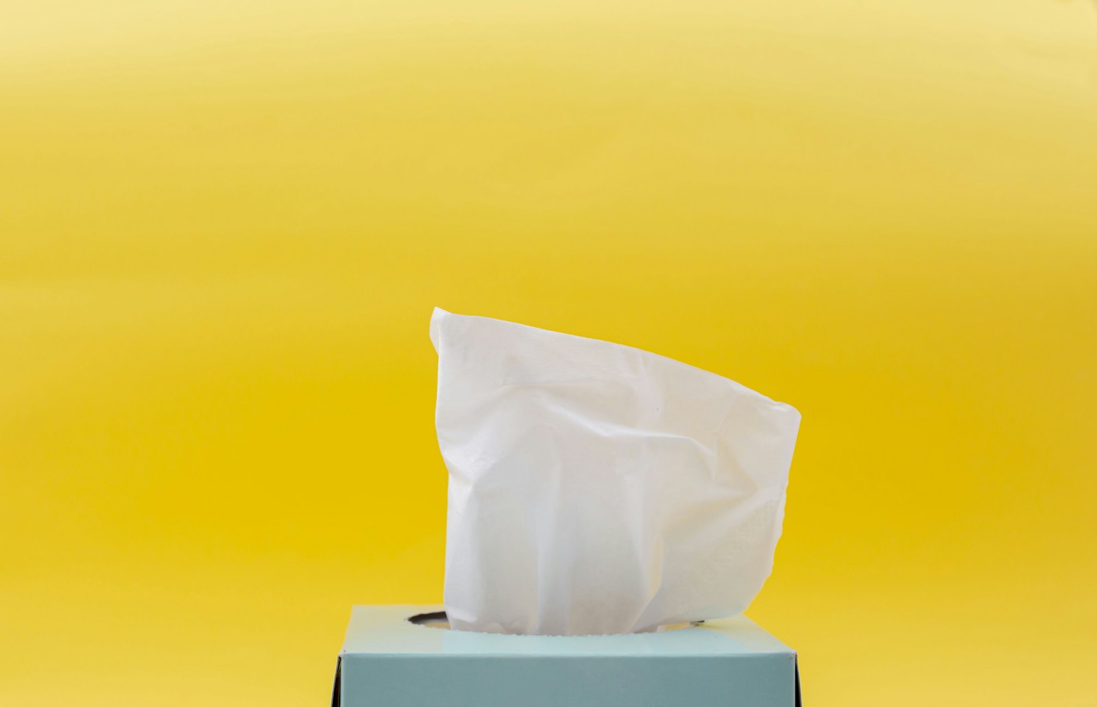 Facial tissue rising from a box
